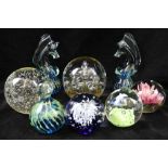 A COLLECTION OF EIGHT VARIOUS GLASS PAPERWEIGHTS, some with bubble inclusions, and two Medina