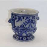 A LATE 19TH CENTURY WESTERWOLD BLUE GLAZED STONEWARE JARDINIERE, with rams head handles, 17.5cm high