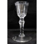 A GEORGE III CORDIAL GLASS, the bowl with engraved rim, facet cut stem on round conical base