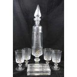 A GLASS ABSINTHE SET, comprising; water dispenser with brass tap and steeple stopper on circular