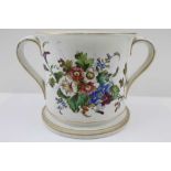 A 19TH CENTURY CERAMIC TWO-HANDLED LOVING CUP, to one side hand painted bouquet of summer flowers,