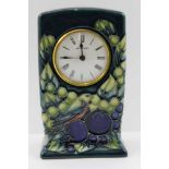 A MOORCROFT POTTERY MANTEL CLOCK, tube lined and painted finch & berries decoration, the dial with