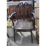 A 20TH CENTURY LOW WHEEL BACKED COUNTRY KITCHEN ARMCHAIR