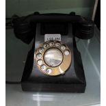 A VINTAGE BLACK FINISHED DIAL TELEPHONE with modern wiring