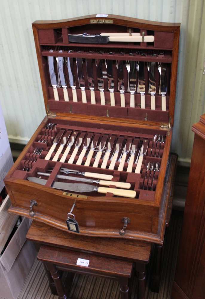 A WELL FITTED OAK CANTEEN OF CUTLERY containing an extensive selection of cutlery from William