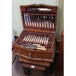 A WELL FITTED OAK CANTEEN OF CUTLERY containing an extensive selection of cutlery from William