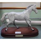 A BESWICK DAPPLE GREY RACEHORSE 'One Man', on polished wood base