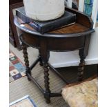 A FIRST QUARTER 20TH CENTURY OAK FINISHED DEMI-LUNE SIDE TABLE with beaded upstand, single central