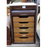 A DESK TOP TAMBOUR FRONTED SET OF FILING DRAWER, by Abbess