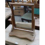 A 19TH CENTURY PINE FRAMED ADJUSTABLE PLAIN PLATE DRESSING TABLE TOP MIRROR on shaped plank plinth