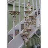FOUR VARIOUS WALL BRACKETS, currently painted cream and highlighted in gilt, with Rococo scrolling