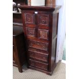 AN IMPORTED MAHOGANY COLOURED WOODEN FREESTANDING CHEST OF DRAWERS with plain ring drop handles