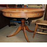 A REPRODUCTION YEW WOOD FINISHED SINGLE PEDESTAL DINING TABLE, with faux drawer fronted apron,