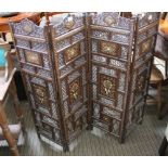 AN INDIAN INLAID WOODEN PIERCED FOUR PANEL FOLDING SCREEN