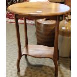 A FIRST QUARTER 20TH CENTURY OAK FINISHED OVAL TOPPED OCCASIONAL TABLE on four shaped legs, united