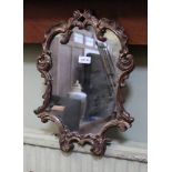 A FANCY GILT FRAMED PLAIN PLATE WALL MIRROR