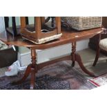 A REPRODUCTION YEW WOOD DINING TABLE