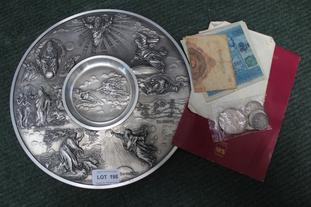 A LARGE CAST METAL PLAQUE together with a selection of German coins and banknotes