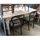 A LARGE PINE SCRUB PLANK TOPPED TABLE on later painted base, fitted with a central cutlery drawer