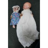 AN ARMAND MARSEILLE BISQUE HEAD BABY DOLL, with blue closing eyes, composition body, in