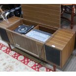 A RETRO DESIGNED WOOD EFFECT CASED TRIPLE BAND RADIO & A TRIPLE SPEED TURNTABLE having built in