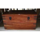 AN ORIENTAL MAHOGANY FINISHED PART METAL BOUND TRAVELLING STYLE TRUNK