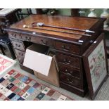A REPRODUCTION MAHOGANY FINISHED TWIN PEDESTAL DESK, of typical form and construction, with well