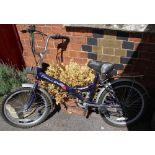 A FOLDING CHALLENGER BICYCLE, model Tornado, finished in deep purple