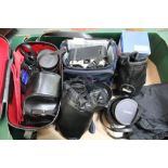 A BOX CONTAINING A SELECTION OF CAMERAS AND ADDITIONAL EQUIPMENT