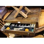 AN OAK TABLE TOP CANTEEN CONTAINING A SELECTION OF CUTLERY