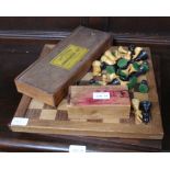 TWO WOODEN CHESS BOARDS together with a selection of chessmen & draughts