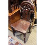 A 19TH CENTURY MAHOGANY FINISHED HALL STAND with fancy shaped back, and solid serpentine fronted