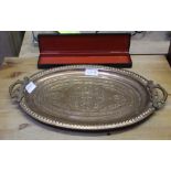 A SMALL OAK CHASED METAL OVAL TWIN HANDLED TRAY together with a Russian hand painted, papier