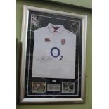 A MARTIN JOHNSON AUTOGRAPHED ENGLAND RUGBY SHIRT from the 2003 World Cup winner, in presentation