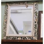 A FLORENTINE FRAMED RECTANGULAR BEVEL PLATE WALL MIRROR