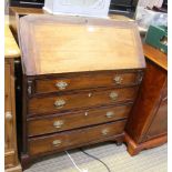 A MIXED WOOD BUREAU, having four full width drawers