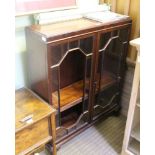 A MAHOGANY FINISHED ADJUSTABLE BOOKCASE with two bar glazed doors