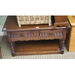 A REPRODUCTION OAK FINISHED RECTANGULAR TOPPED COFFEE TABLE with two inline drawers and a magazine