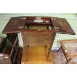 AN EDWARDIAN MAHOGANY WORK TABLE satinwood crossbanded, the top opens to reveal a compartmental tray