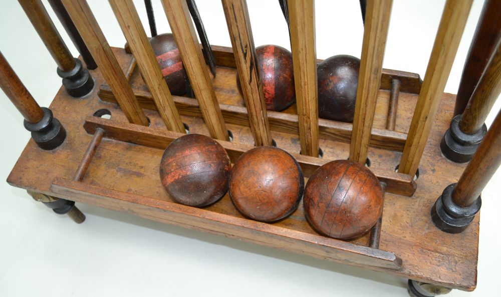 A WOODEN CROQUET SET ON STAND comprising seven mallets, six balls, two posts & five iron hoops, - Image 6 of 6