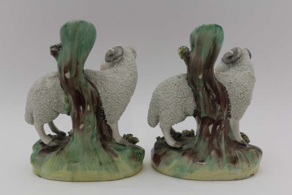 TWO 19TH CENTURY STAFFORDSHIRE POTTERY SHEEP SPILL HOLDERS, 13.5cm high, together with a pair of - Image 5 of 5