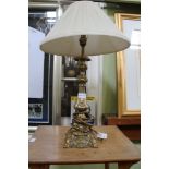 A FANCY CAST BRASS EFFECT TABLE LAMP