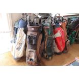 FIVE GOLF BAGS plus contents