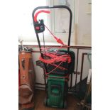 AN ELECTRIC POWERED QUALCAST BRANDED LAWNMOWER with grass collection basket