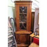 A MAHOGANY COLOURED IMPORTED HANDWOOD CORNET UNIT with barglaze upper door & plain lower