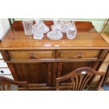 A LATE 19TH CENTURY MAHOGANY FINISHED SIDE UNIT with two inline drawers over two plain panel