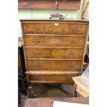 A REPRODUCTION WALNUT FINISHED CHEST ON STAND, the upper section having four full width drawers,