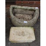 A D SHAPED GARDEN PLANTER together with a garden brick