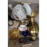 A BOX CONTAINING OIL LAMPS together with chromed pocket lighters, etc
