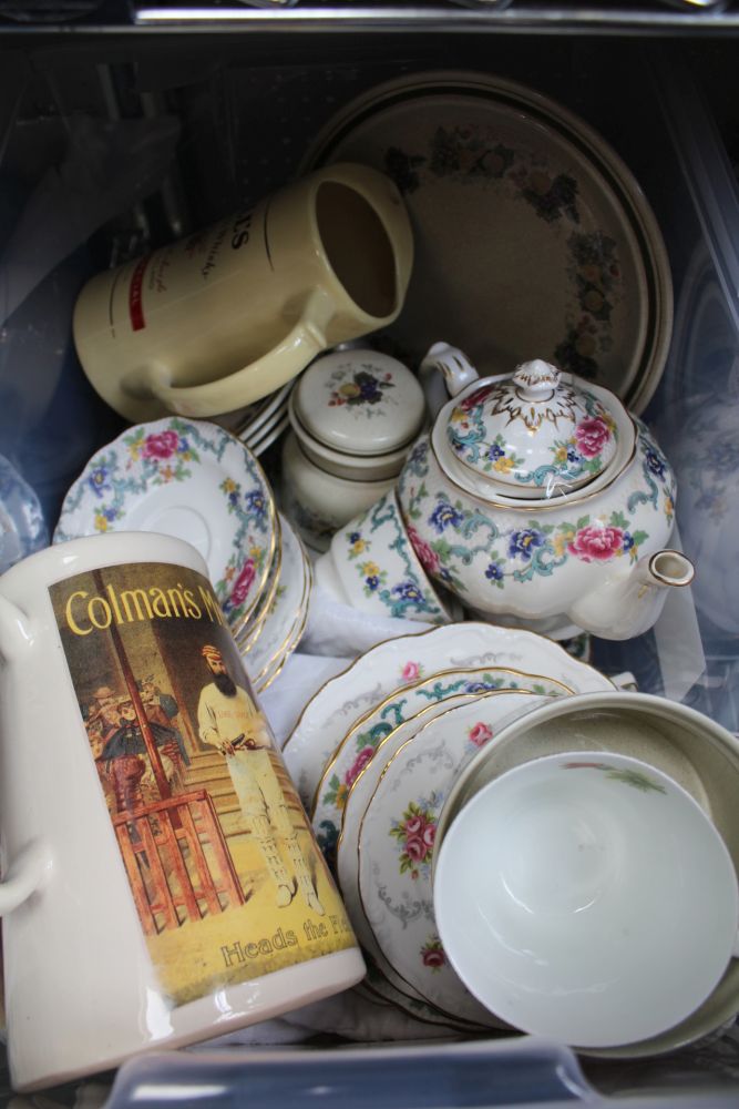 A PLASTIC CRATE CONTAINING DOMESTIC CROCKERY including part tea service, advertising jugs, etc
